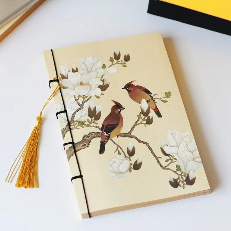 A5 antique thread-bound notebook with embossed cover and decorative tassels