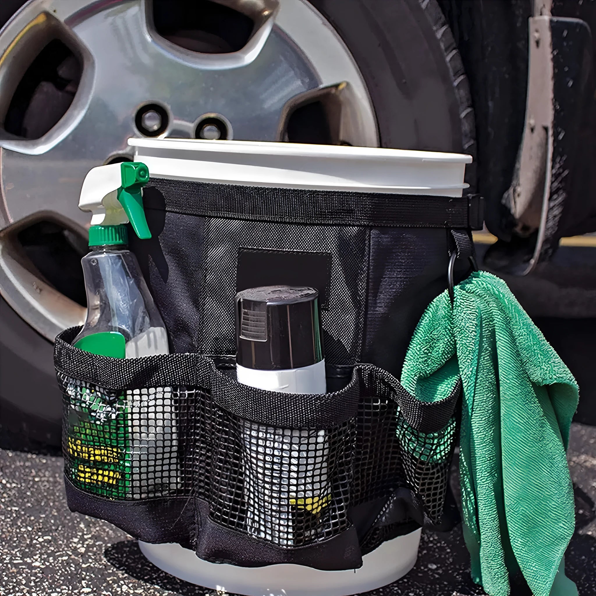 Black polyester bucket storage bag hanging on 5 gallon bucket for tool organisation