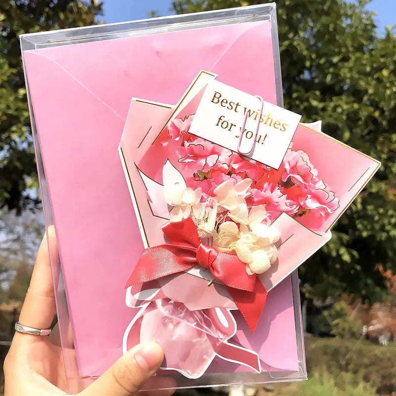 Handmade 3D boxed greeting card with butterfly shape, hot stamping, and artificial flowers on coated paper.
