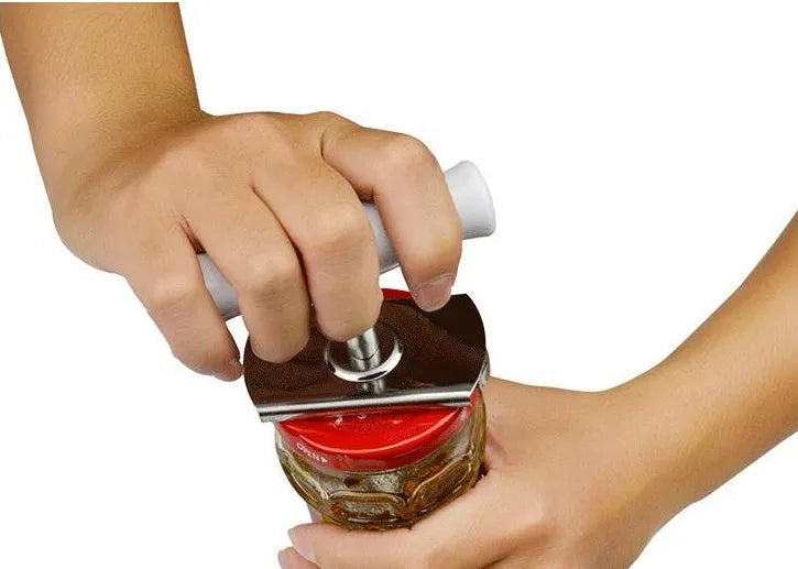 White stainless steel manual adjustable bottle opener with gear design on a table