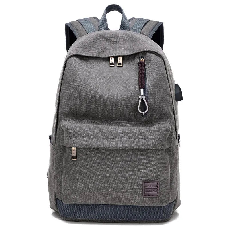 Canvas backpack with USB charging port and multiple pockets including a laptop compartment