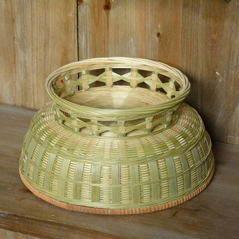 Handmade natural bamboo storage basket shown in one of three size variations for household organisation.