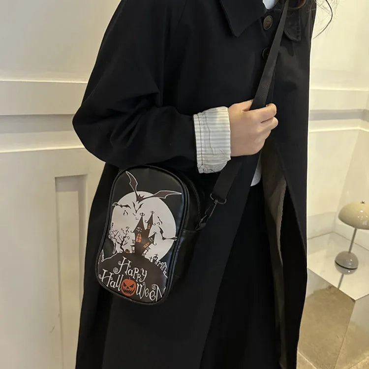 Halloween graffiti print crossbody bag with cartoon pumpkin ghost bat design in orange colour