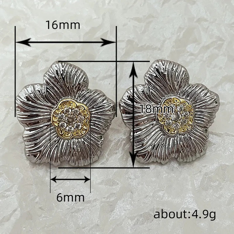 Retro textured two-tone copper stud earrings with gardenia petal motif on white background
