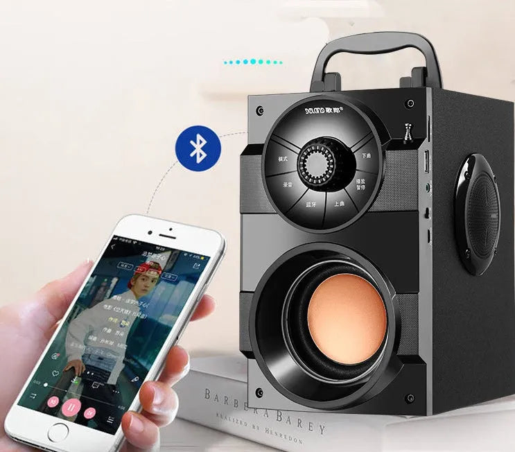 Black portable mini audio system with satellite speakers and subwoofer unit showing 3.5mm audio cable