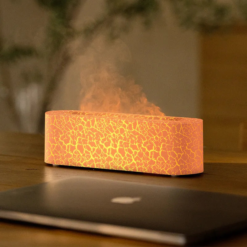 Square black creative lava USB humidifier and aroma diffuser with colourful LED flame lighting on a desk.