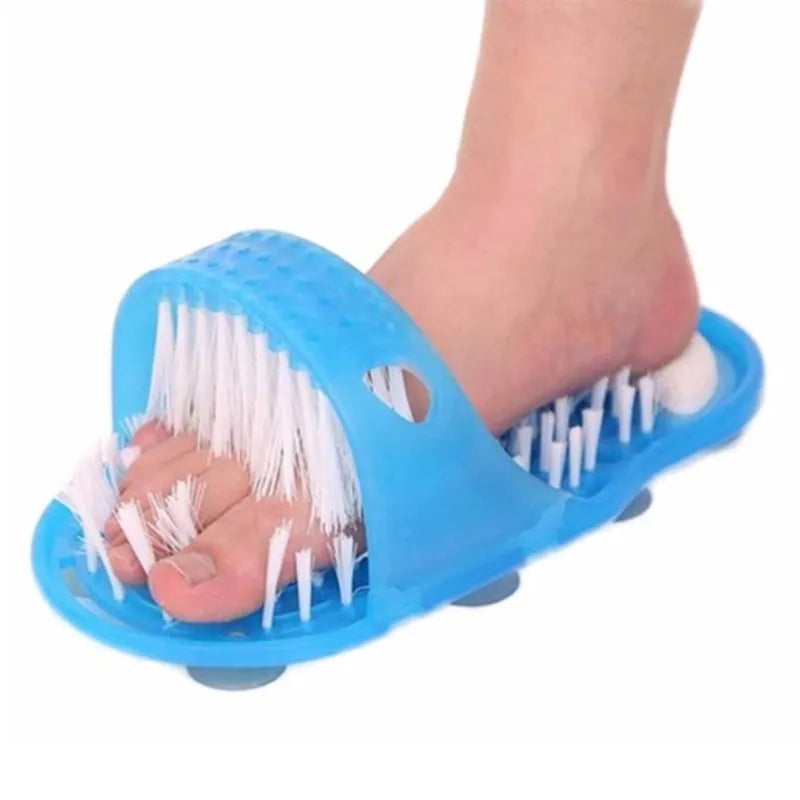 Blue shower feet slipper with suction cups and built-in pumice stone on a wet shower floor