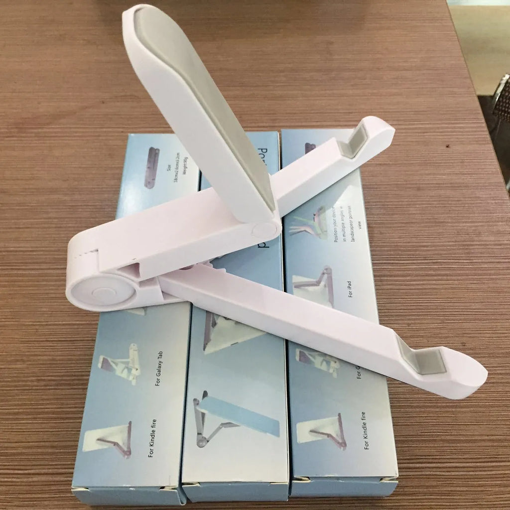 Foldable tablet holder in black showing both folded flat and opened positions with smartphone mounted