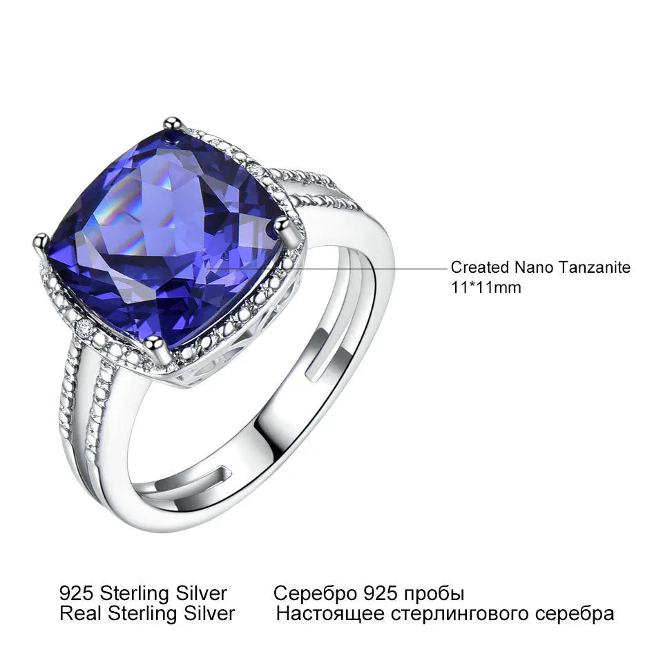 Women's 925 Sterling Silver ring with a blue Tanzanite stone, shown on a finger.