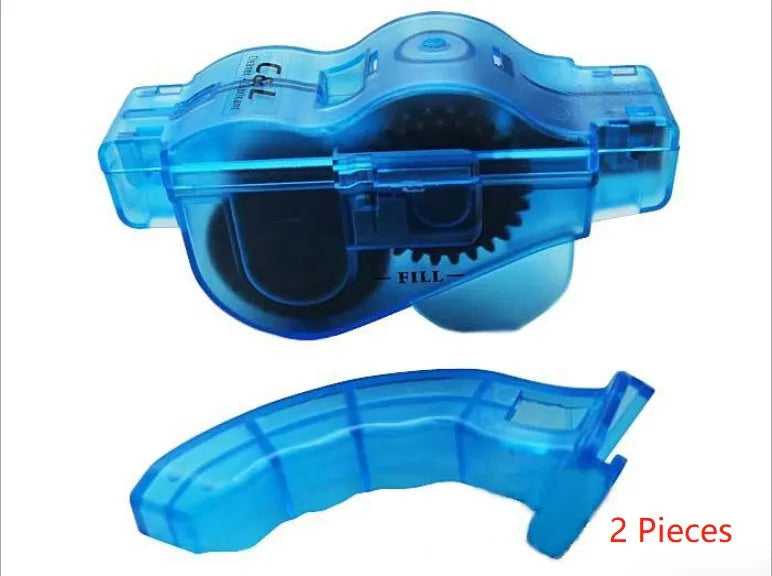 Blue plastic bicycle chain cleaning washer set with brushes on a bike chain