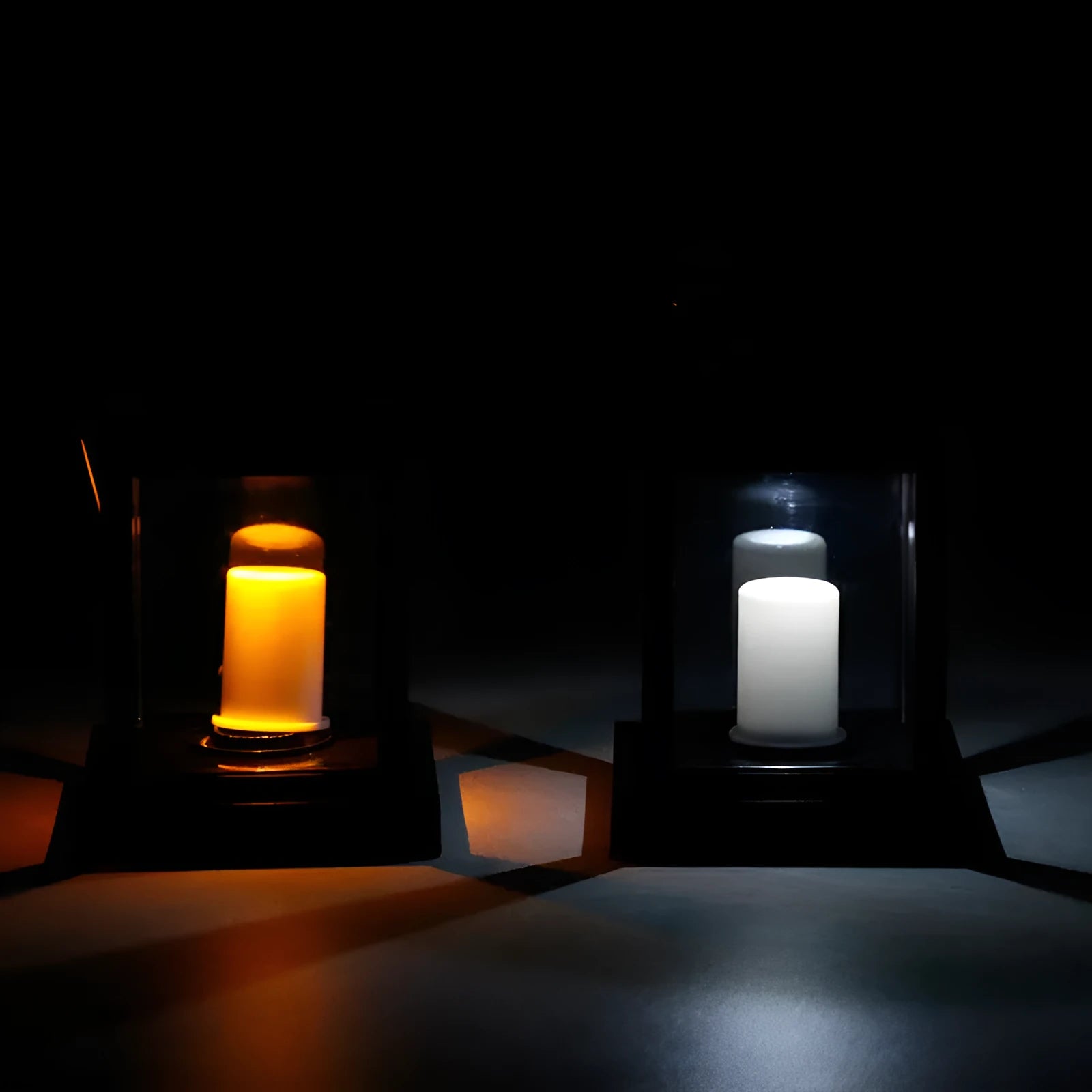 Solar LED candle light with black plastic shade, monocrystalline silicon panel, and IP44 waterproof rating for outdoor garden use