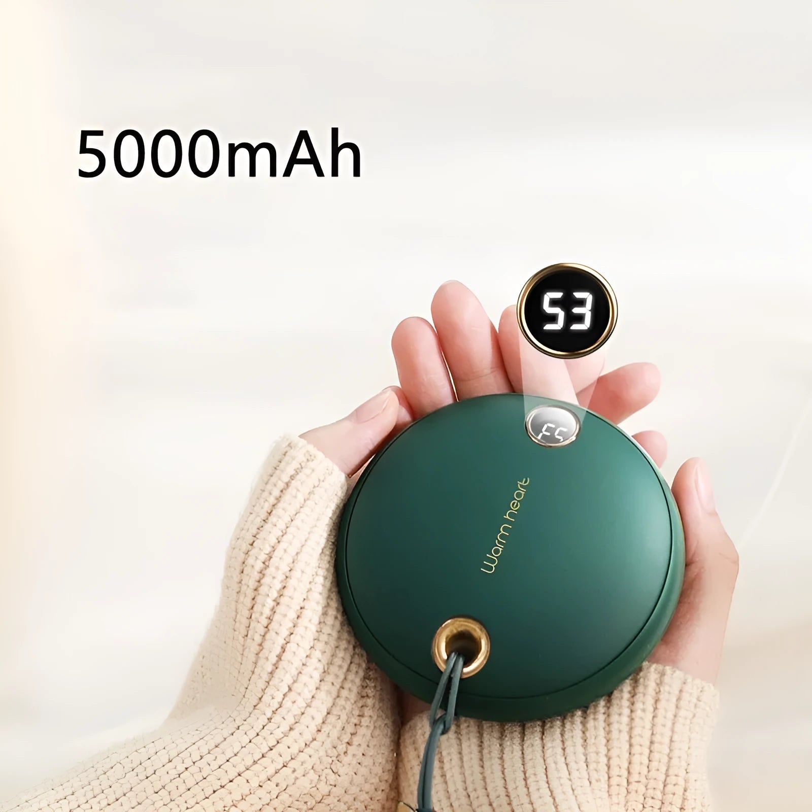 Green 5000mAh power bank with hand warmer function showing digital display, measuring 89.5mm square