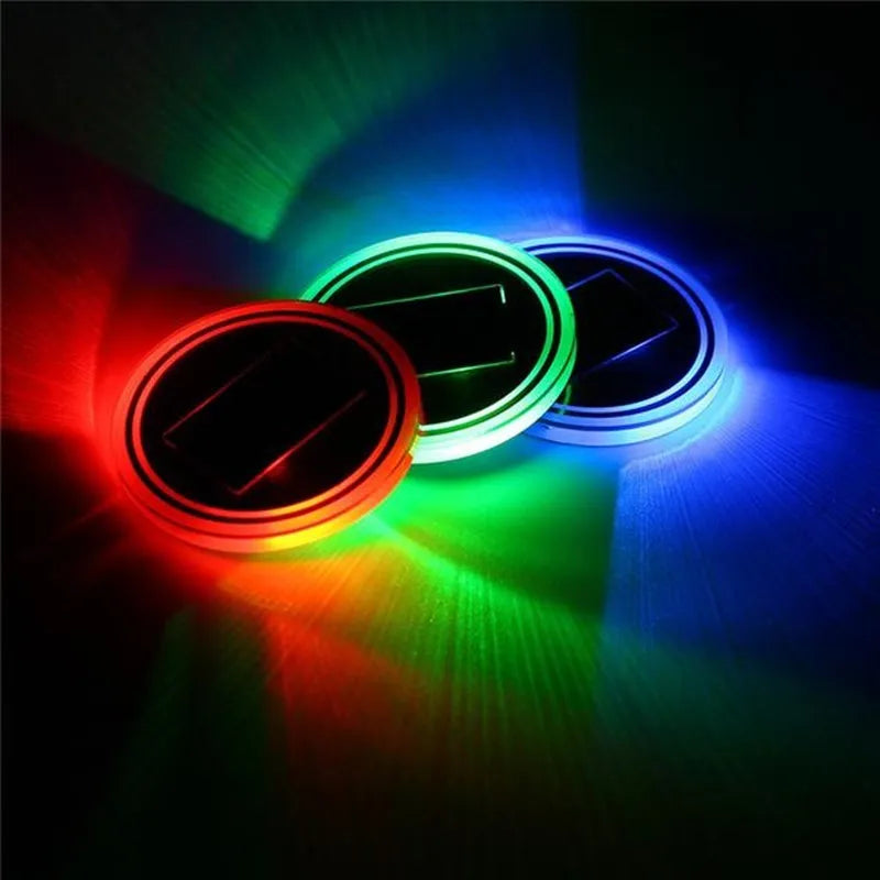 Solar-powered LED cup mat in blue, 7.2cm diameter, with solar panel on a windowsill