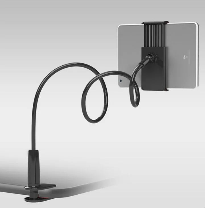 Black bedside oversize flat panel mobile phone stand with long flexible arm extended on a wooden table.
