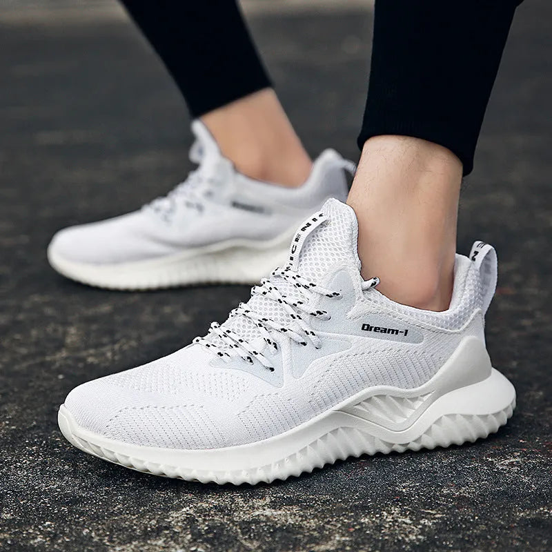 Low-top adult running shoes in a plain style with a front strap and mesh upper.