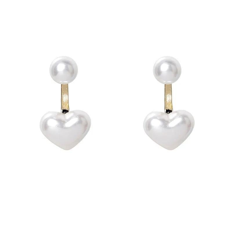 Korean style heart-shaped alloy stud earrings for women with artificial gem inlay on a white background.