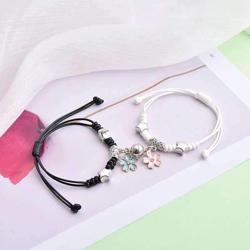 Alloy magnetic suction bracelet pair for couples with symbolic design options