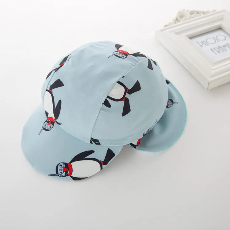 Boys' penguin print polyester swimsuit set with matching swimming cap for sun protection