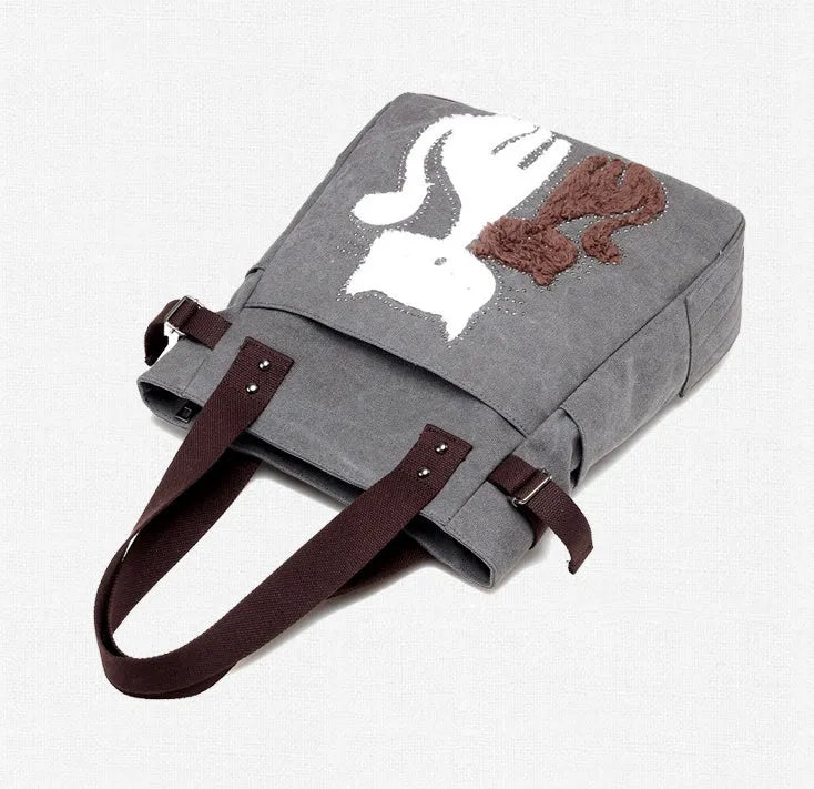 KVKY women canvas shoulder bag with cute plush cat applique in beige colour on white background