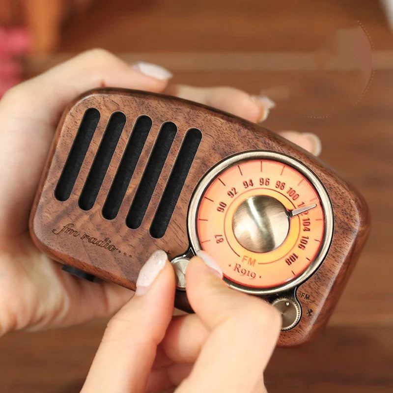 Retro wooden wireless mini speaker in cherry wood finish showing compact dimensions