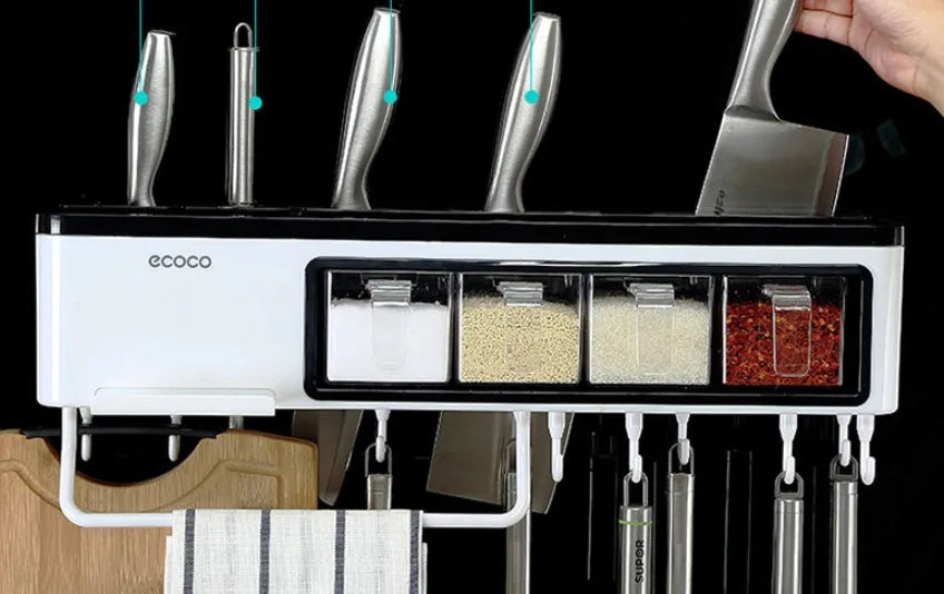 White plastic wall-mounted kitchen storage box with compartments for tools and seasonings