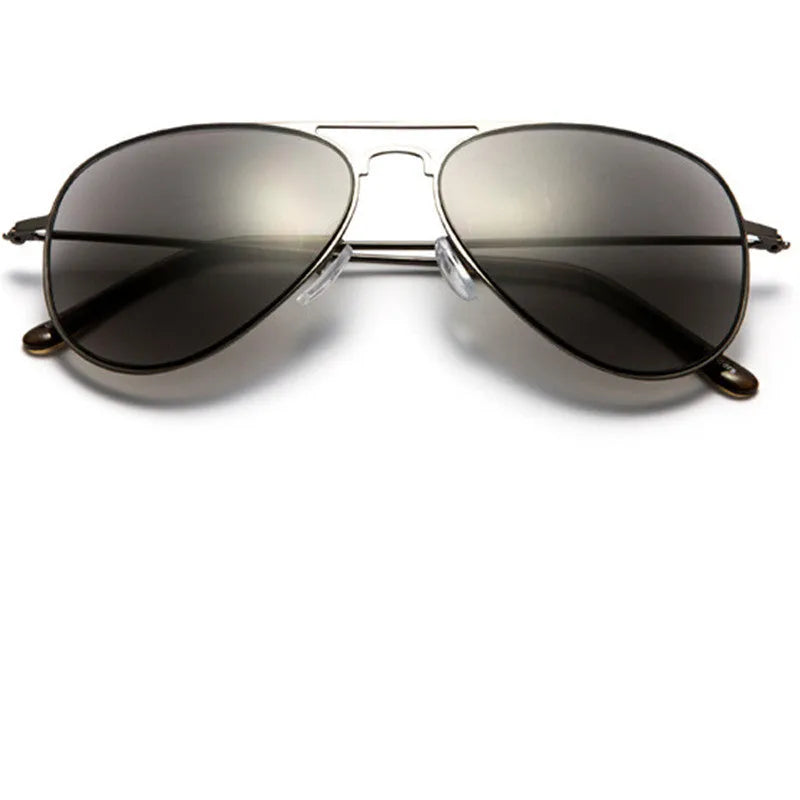 Full lens sun reading glasses with black stainless steel frame resting on a table