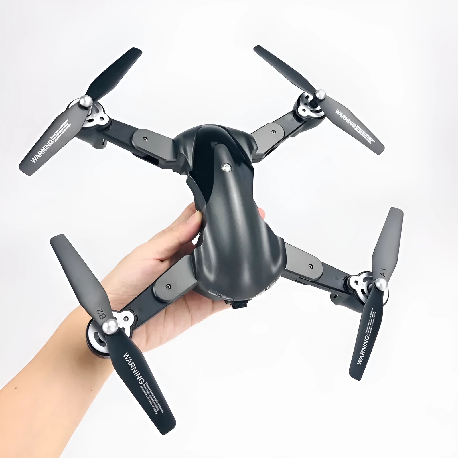 Black and gray four axis drone with 1080P camera, 33.2 cm width, on a plain background