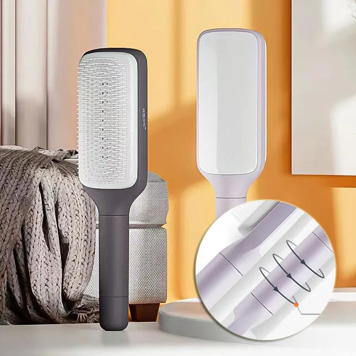 Roland purple self-cleaning hair brush with rotating handle for easy hair removal.