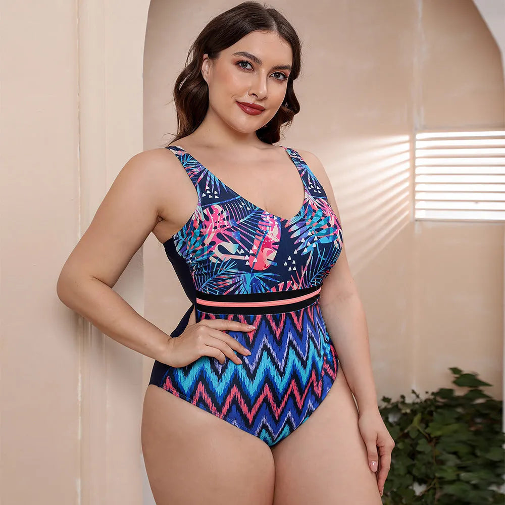 Women's one-piece striped spaghetti strap swimsuit with printed patterns in blue, white, and green options.