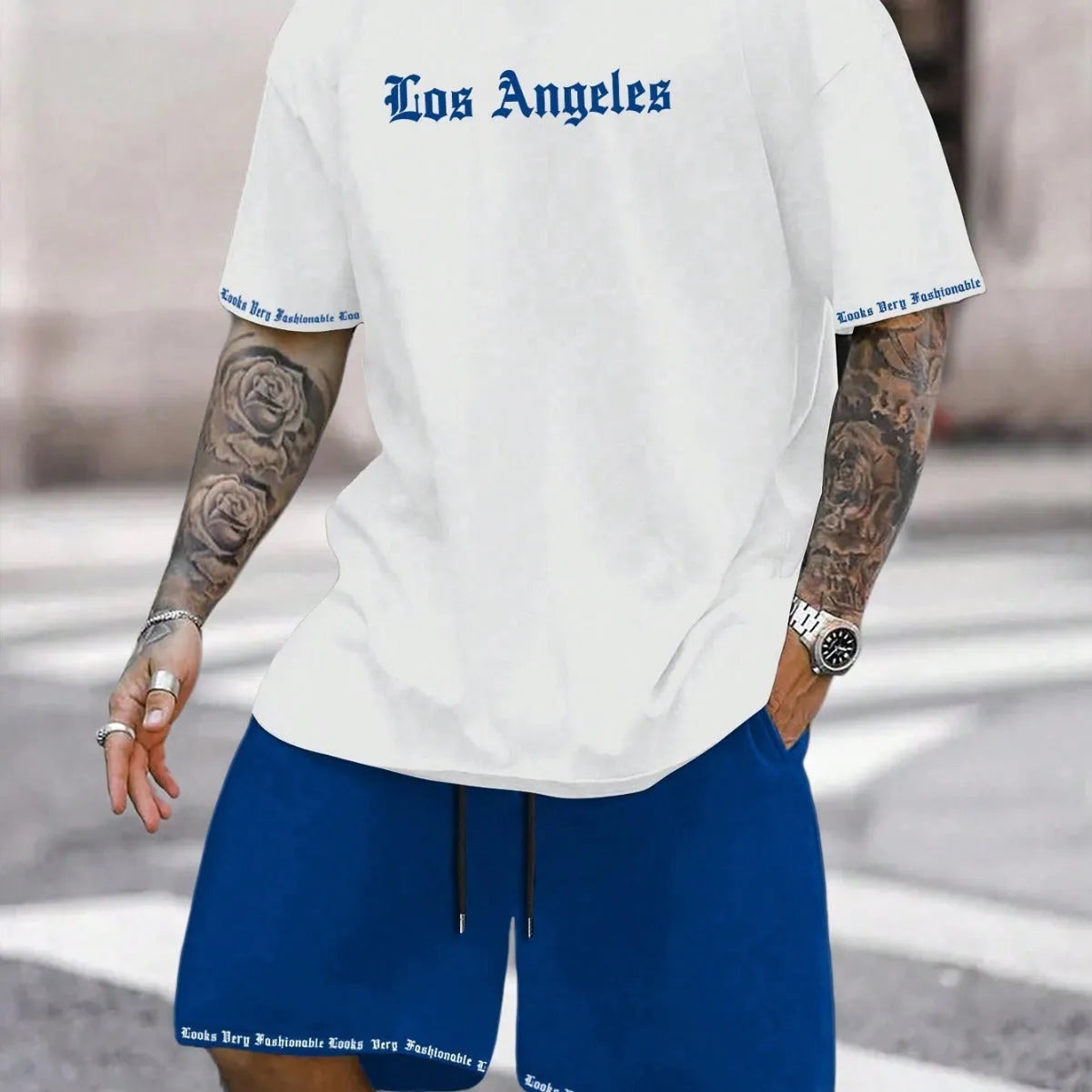 Sports style short-sleeved shirt and matching shorts set in a thin, printed fabric on a mannequin.
