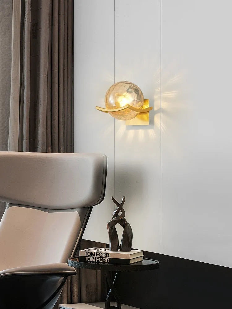 European wall lamp with black base and milky white cover, mounted on bedroom wall