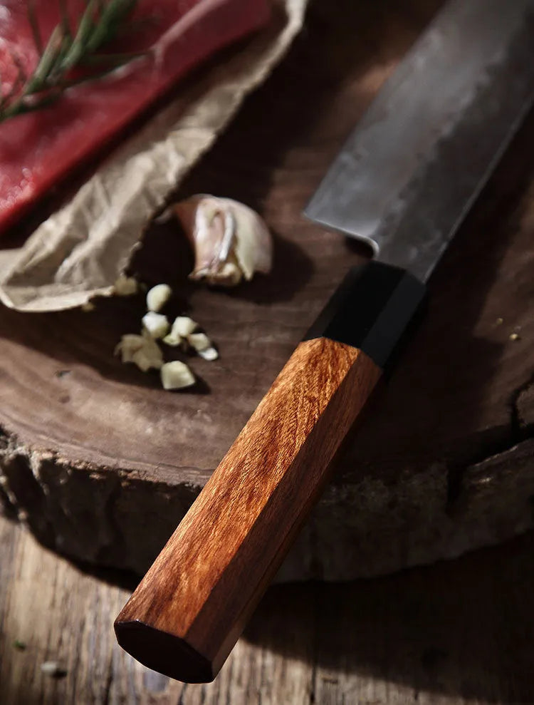 Silver hand forged Santoku chef knife with 4034ZW stainless steel blade, 149cm length, on cutting board