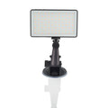 Black aluminium LED conference light with 96 LEDs, measuring 116mm wide, beside a laptop
