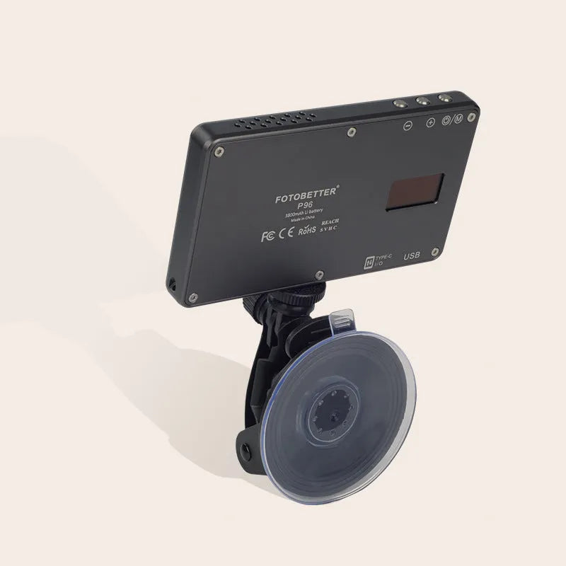 Black aluminium LED conference light with 96 LEDs, measuring 116mm wide, beside a laptop