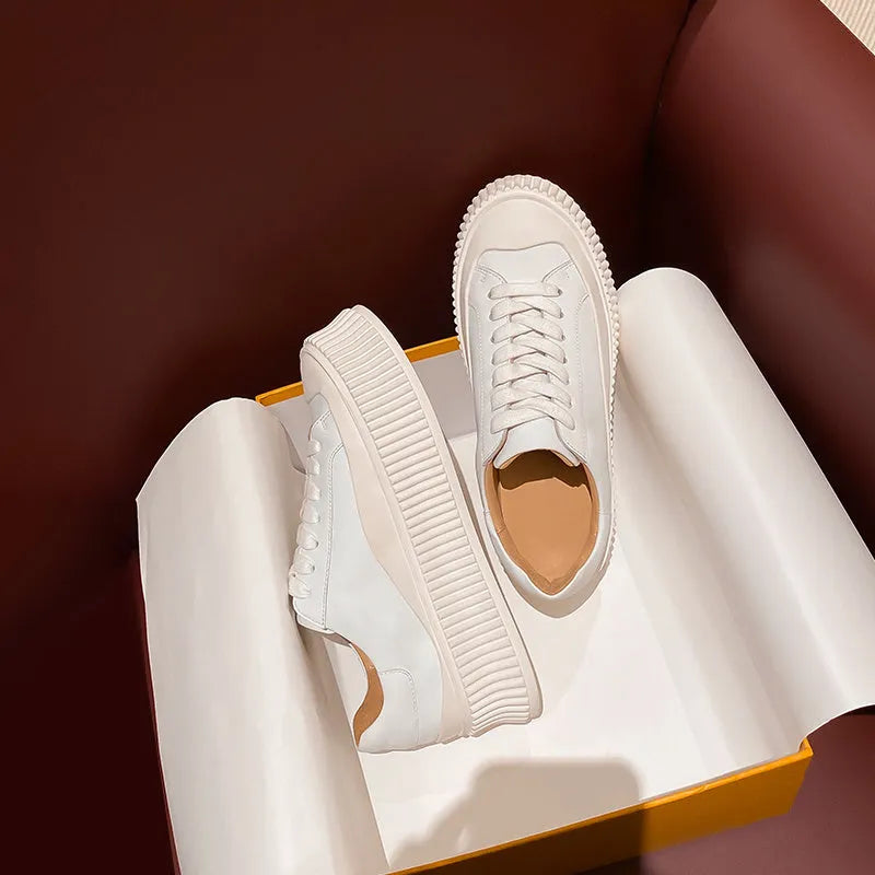 Women's thick bottom platform sneakers with suede leather, cross binding lacing, and muffin heel design in white colour