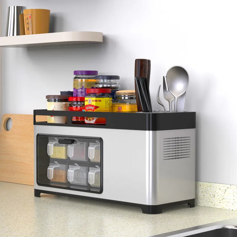 Kitchen storage box with lid made of PP and stainless steel in silver finish, holding seasoning bottles, knife and chopsticks on a shelf