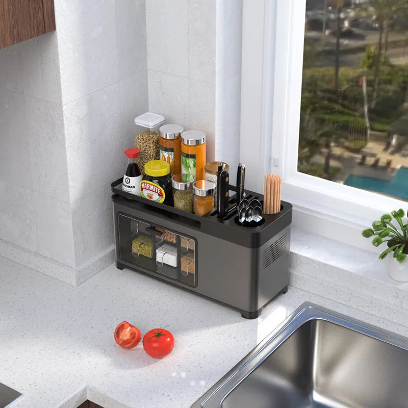Kitchen storage box with lid made of PP and stainless steel in silver finish, holding seasoning bottles, knife and chopsticks on a shelf