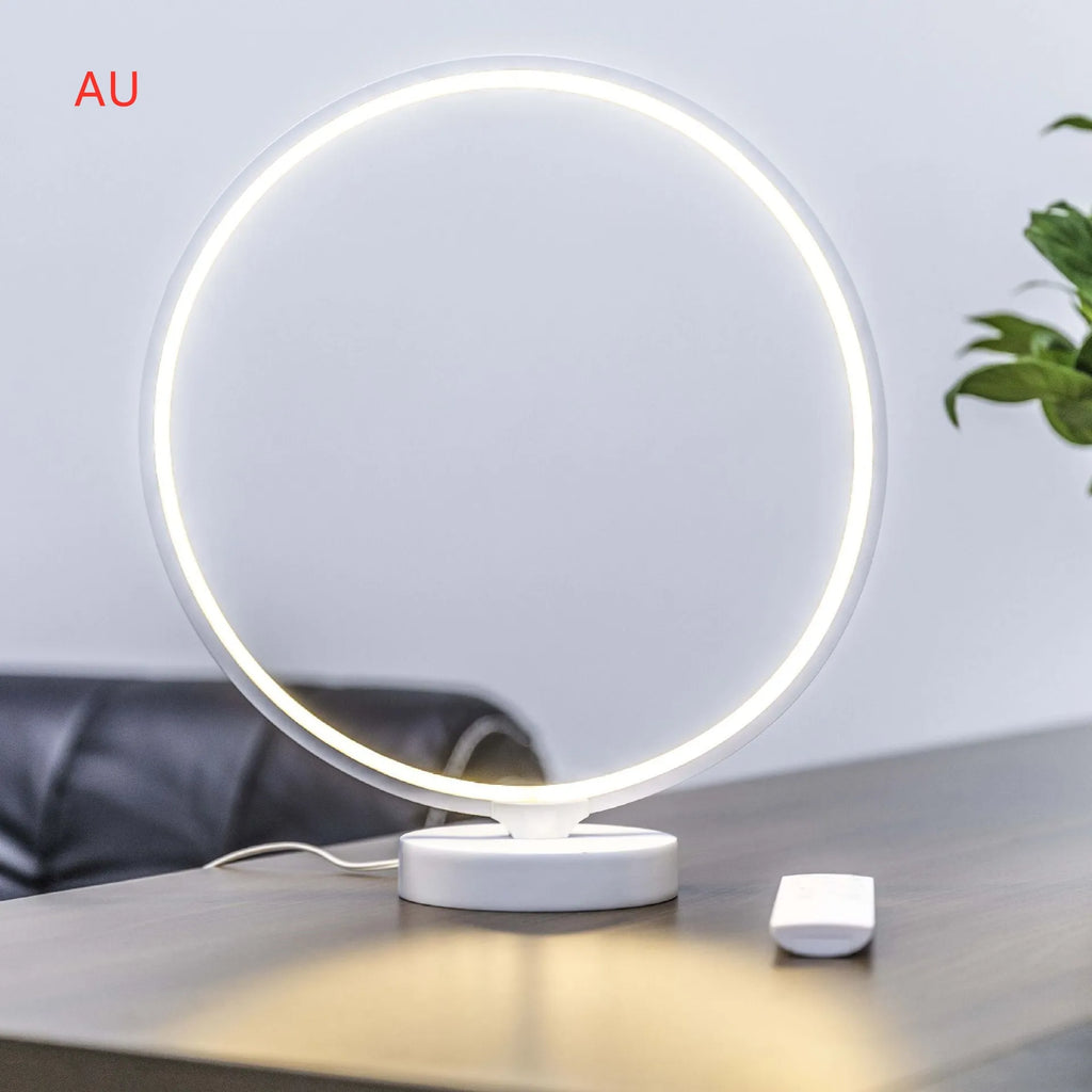 White full moon lamp table light with remote control on wooden surface