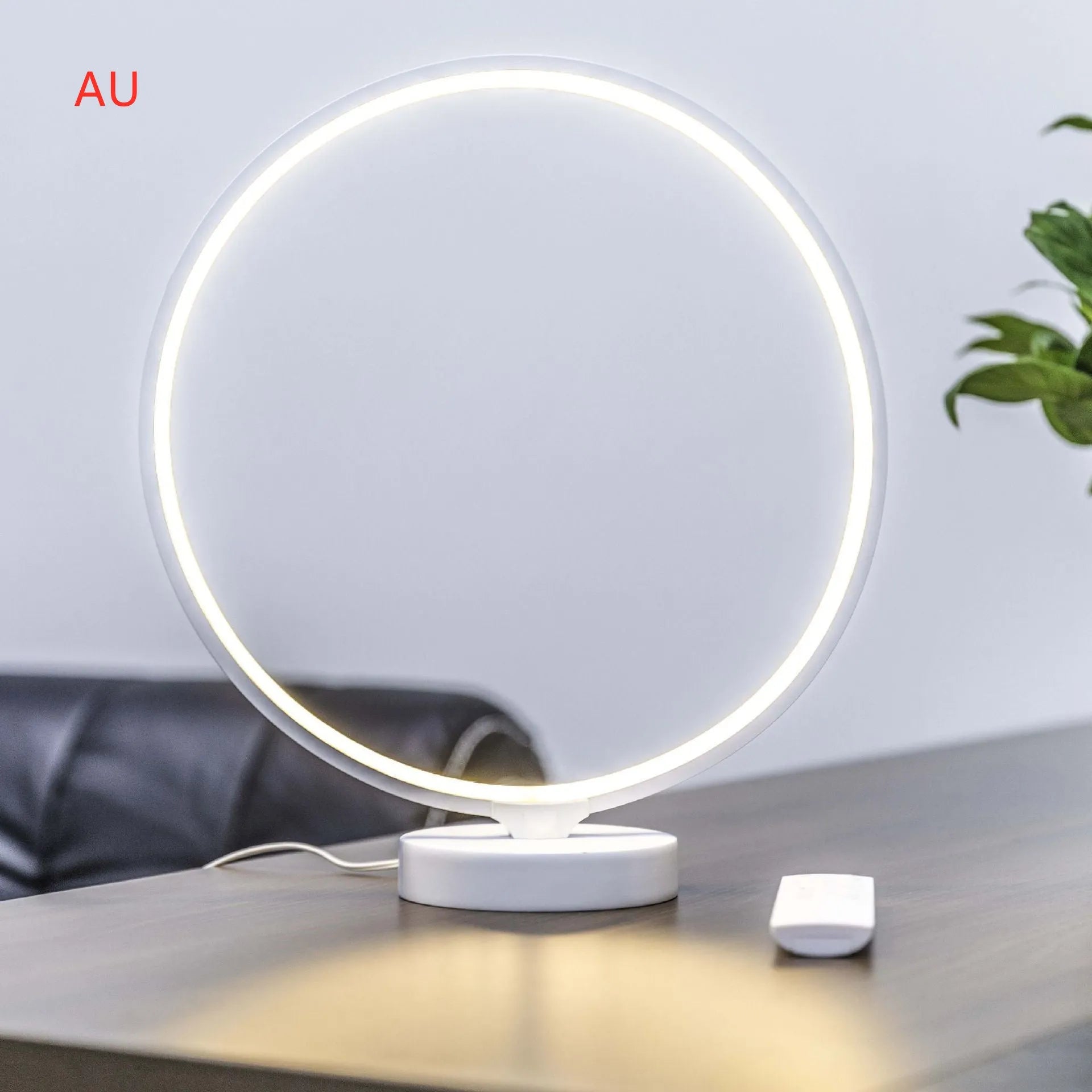 White full moon lamp table light with remote control on wooden surface