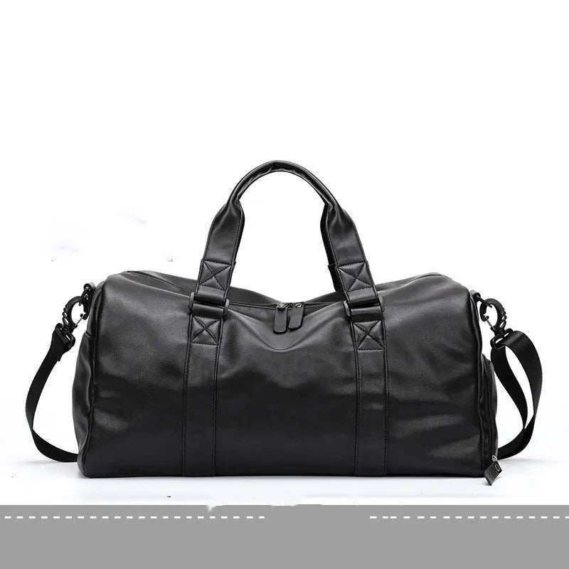Large black PU leather sports training bag with zipper opening and single strap, showing internal organiser pockets.