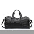 Large black PU leather sports training bag with zipper opening and single strap, showing internal organiser pockets.