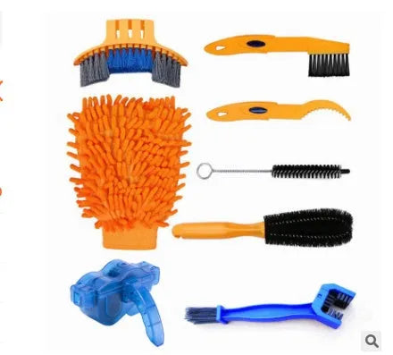 Blue plastic bicycle chain cleaning washer set with brushes on a bike chain