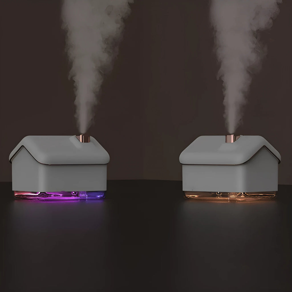 White igloo-shaped ultrasonic humidifier and essential oil diffuser with LED light on a table.