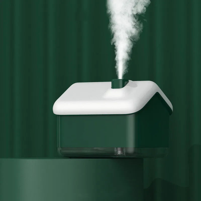 White igloo-shaped ultrasonic humidifier and essential oil diffuser with LED light on a table.