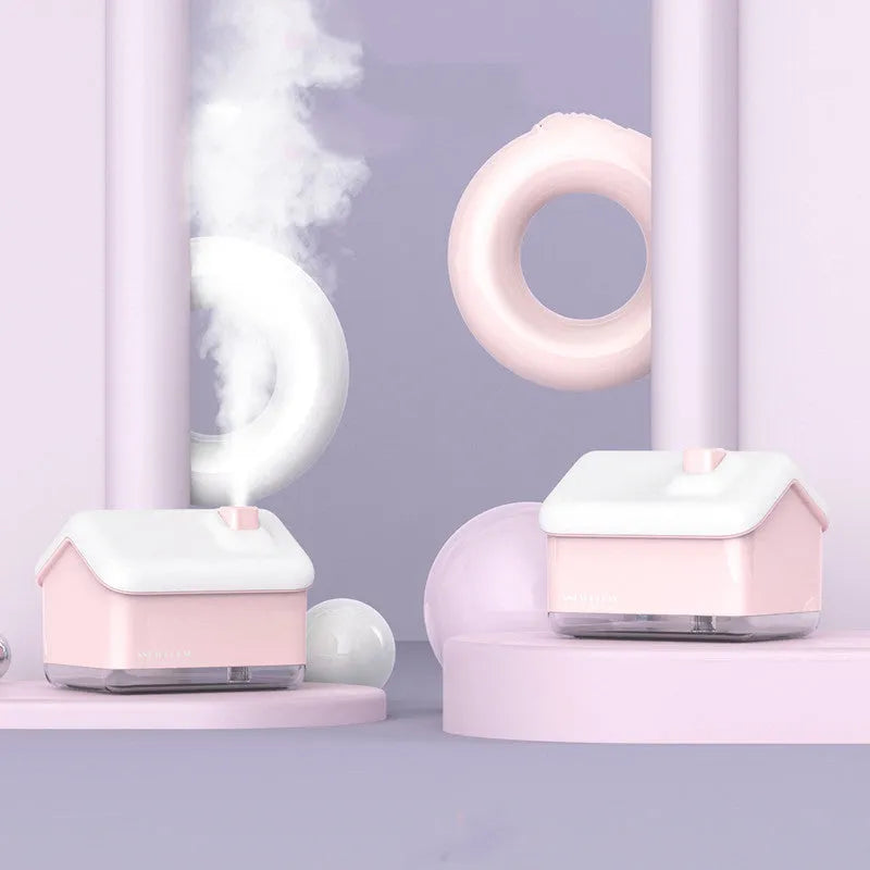 White igloo-shaped ultrasonic humidifier and essential oil diffuser with LED light on a table.