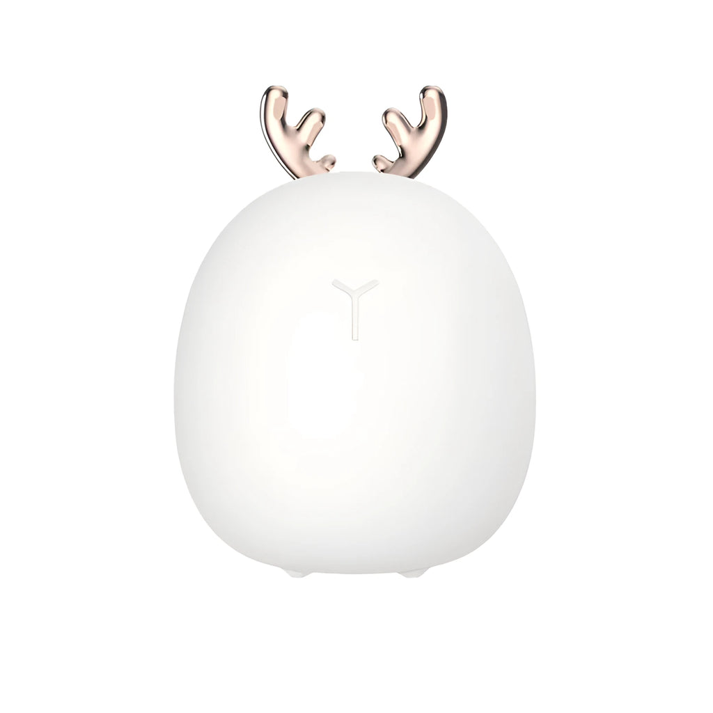 Cartoon deer silicone night light with USB charging cable and touch switch on a bedside table