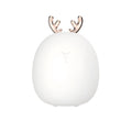 Cartoon deer silicone night light with USB charging cable and touch switch on a bedside table