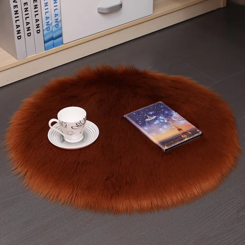 Round plush machine-woven carpet in beige on a wooden floor, 35cm diameter