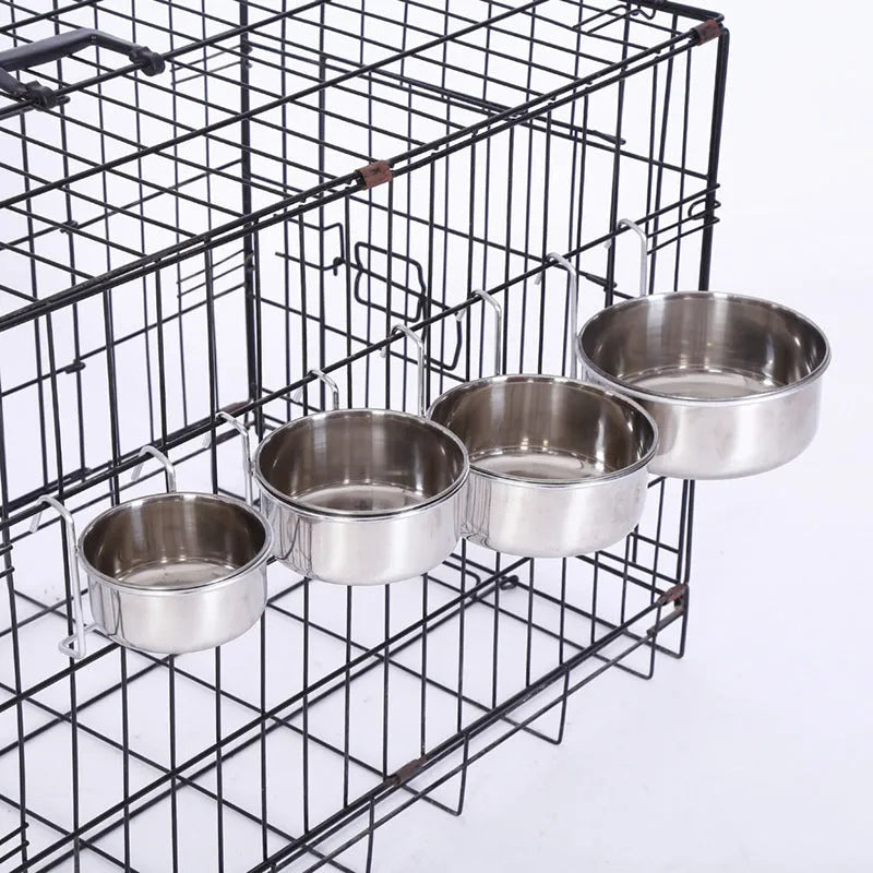 Set of six stainless steel pet food bowls with frame, sizes 10cm to 20cm, on floor