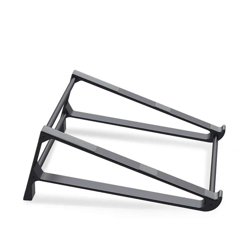 Silver aluminium laptop stand with tablet storage slot underneath, holding a MacBook and an iPad on a desk